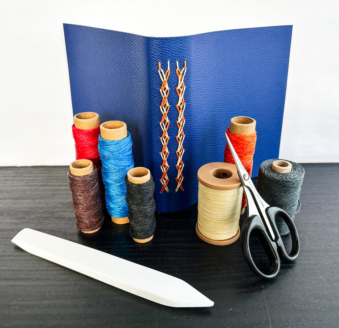 Cutting mat full of bookbinding tools