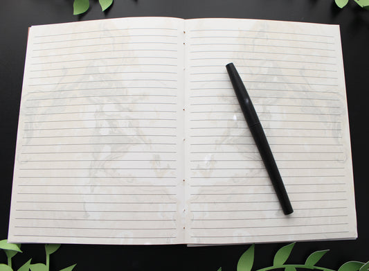 Open journal with lined marbled pages