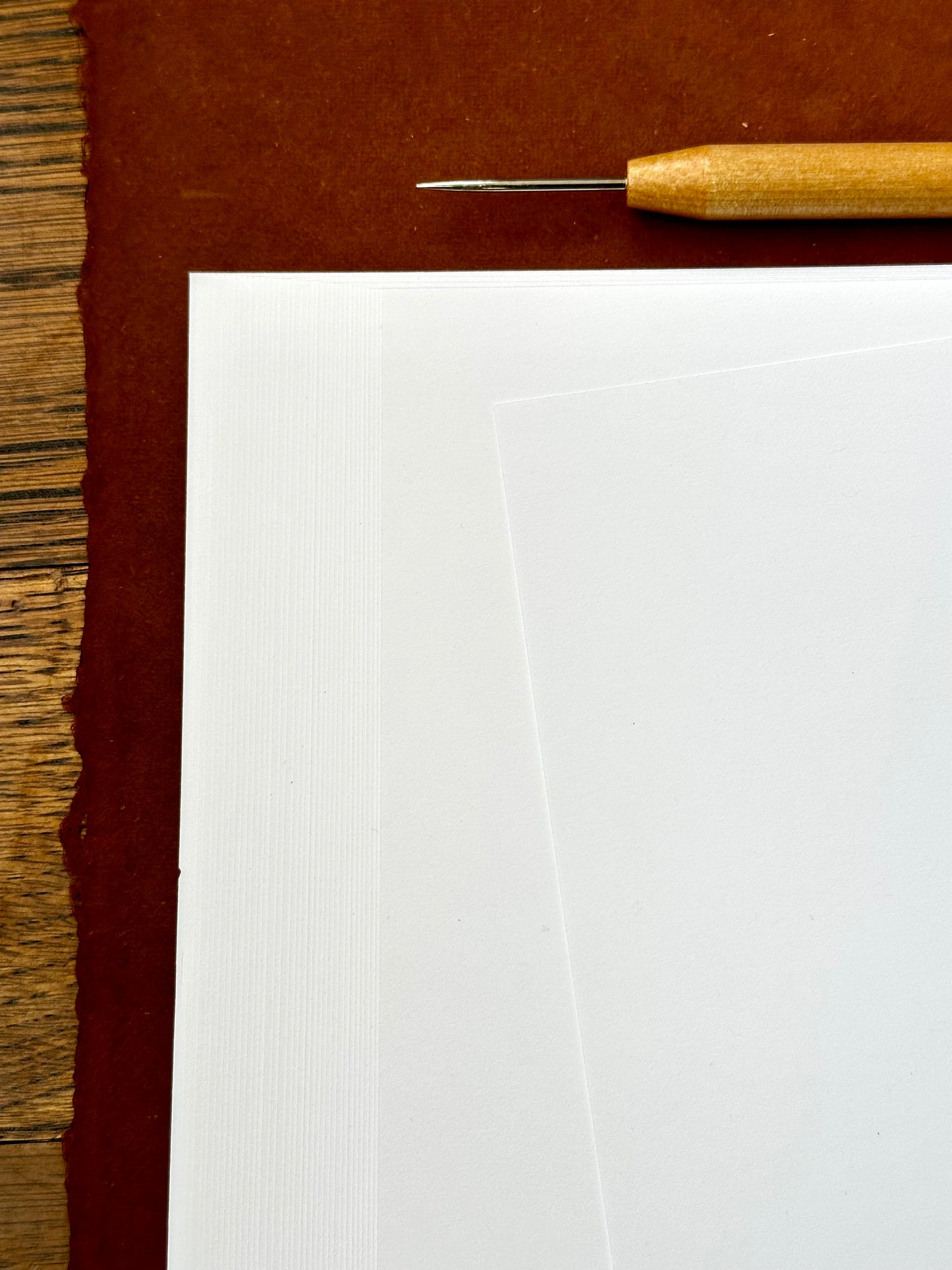 BLANK Short Grain Bookbinding Paper - 8.5" x 11"-  to enhance your book binding projects.  This smooth finish, 70 lb. text weight white paper is 20% post consumer waste and acid free, ensuring high quality and eco-friendly book binding projects.